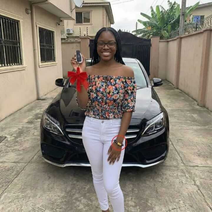 New car, bracelet circled on her wrist